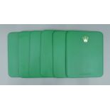 A set of six Rolex placemats. 19 x 23.