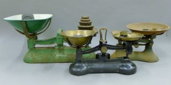 Three sets of vintage scales and weights. The largest 46 cm long.