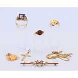 A quantity of 9 ct gold jewellery, including three rings, a chain, a cross pendant, etc. 21.