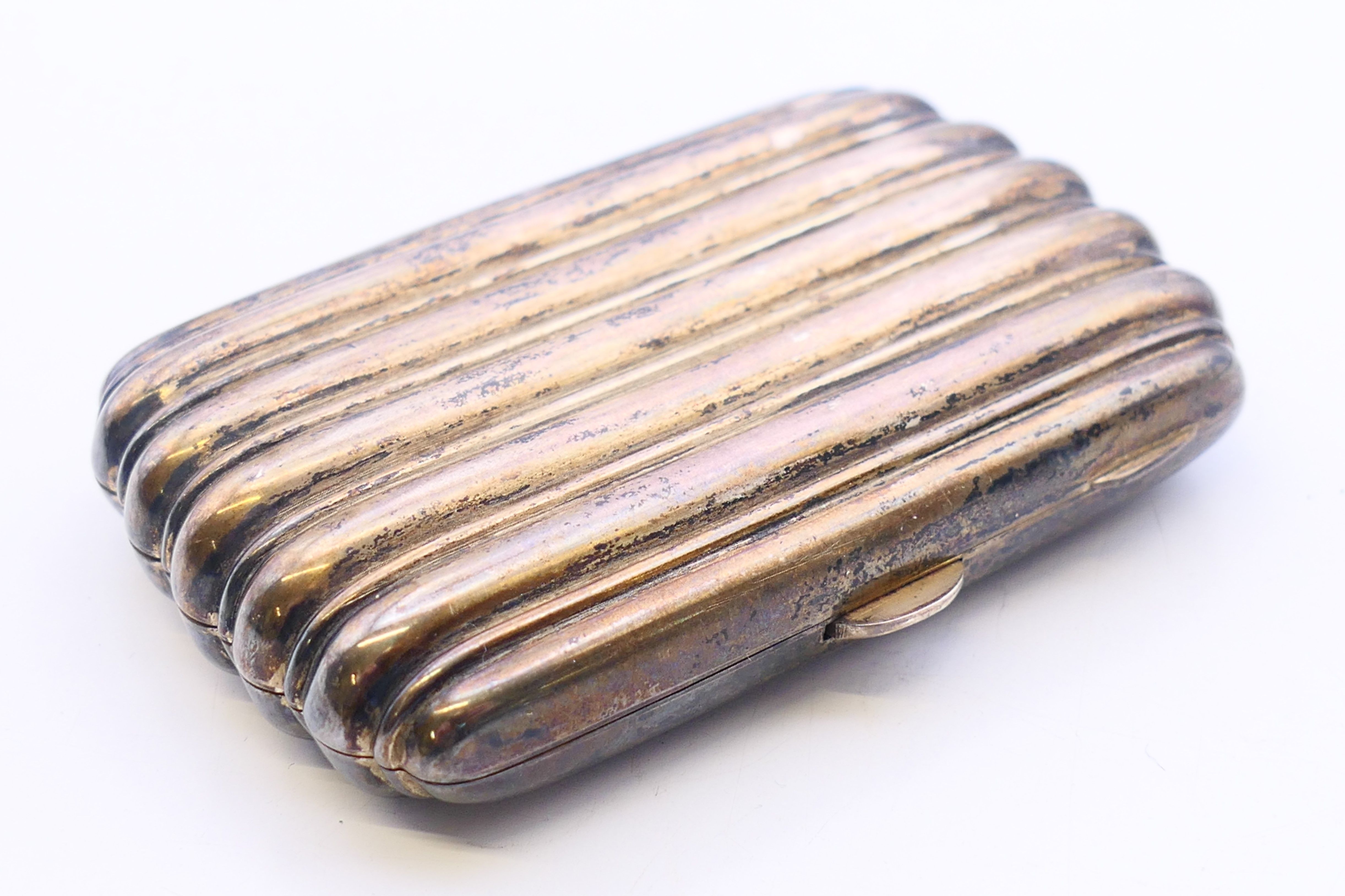 A silver cigarette case. 8 cm x 5 cm. 49.9 grammes total weight.