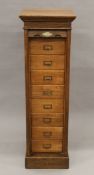 An early 20th century oak tambour-fronted filing cabinet. 37 cm wide x 115.5 cm high.