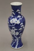A 19th century blue and white Chinese porcelain vase of slender shape painted with prunus blossom,