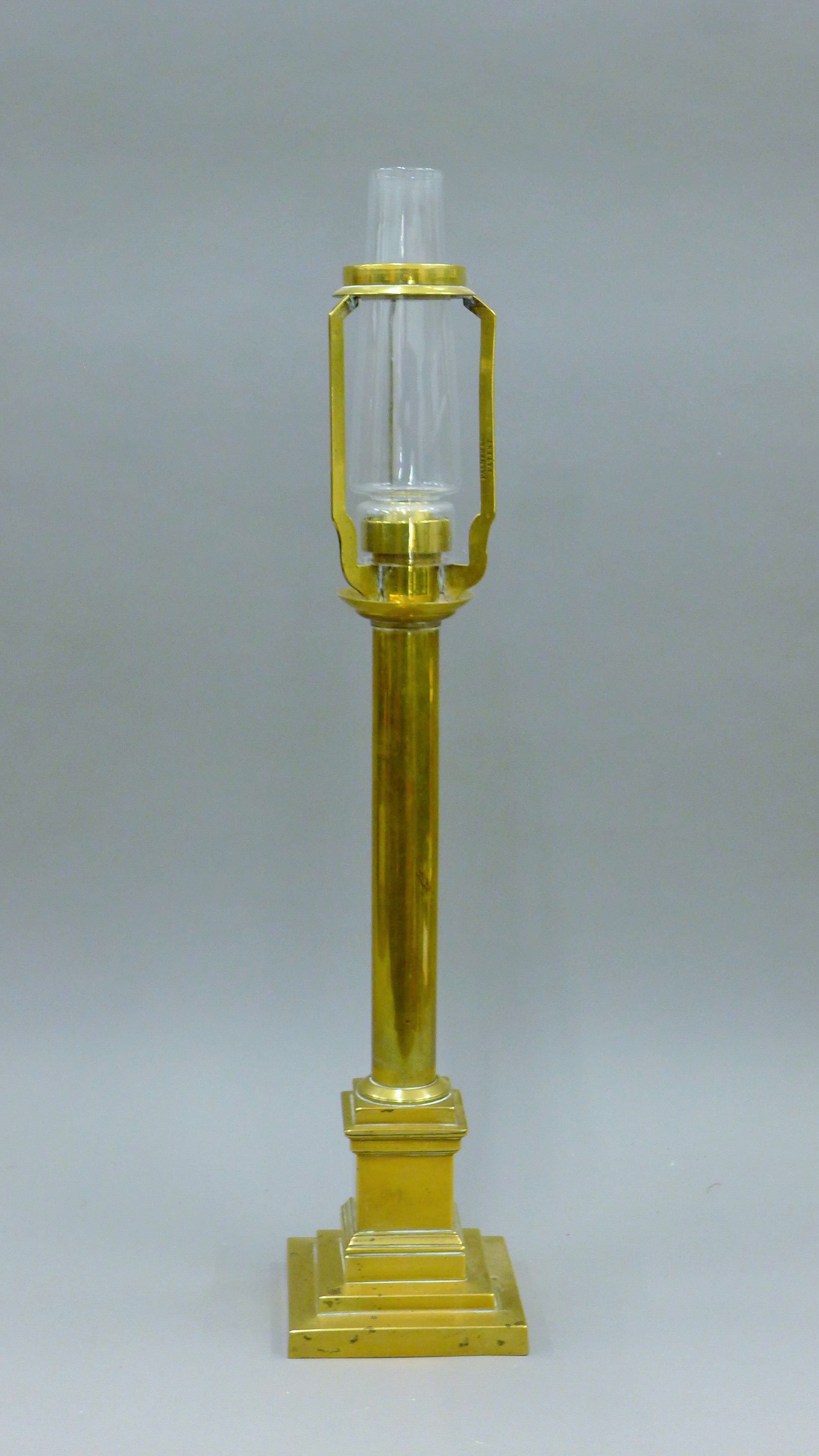 A Victorian Palmer and Co patent brass lamp. 64 cm high overall.