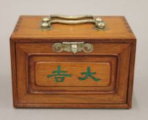 A small mahjong set, the ornate box containing bamboo and bone counters etc, with players' manual.