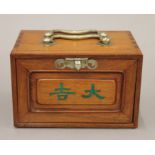 A small mahjong set, the ornate box containing bamboo and bone counters etc, with players' manual.