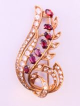 An unmarked gold floral spray brooch 8 grammes. 5 cm high.