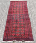 A Bokhara wool runner. 71 cm x 235 cm.