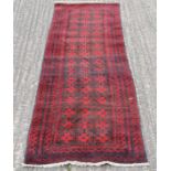 A Bokhara wool runner. 71 cm x 235 cm.