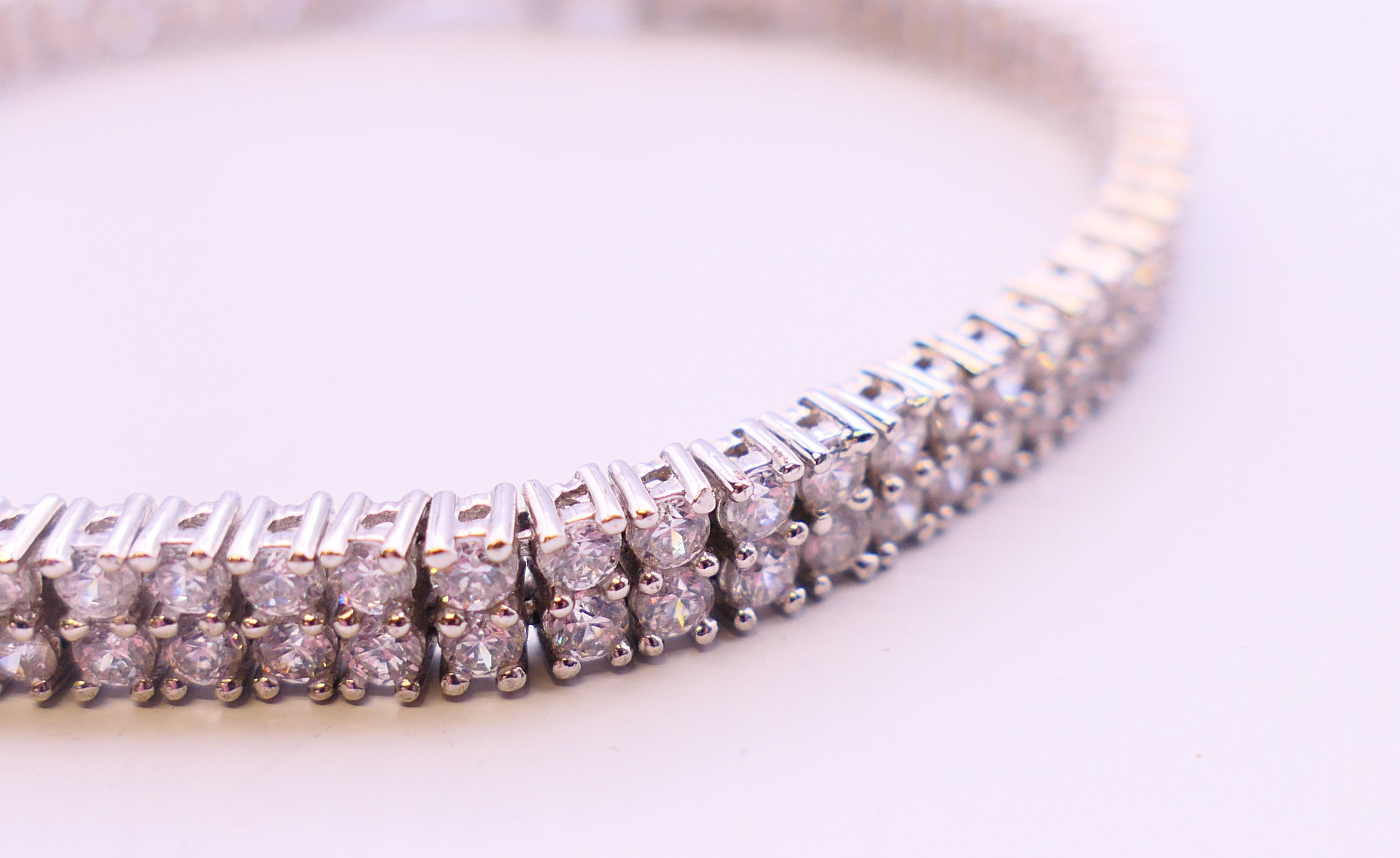 A silver cubic zirconia line bracelet. 20 cm long. - Image 3 of 5