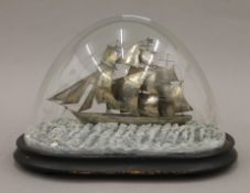 A 19th century Chinese silver model of the tea clipper Spindrift under a glass dome.