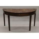 A 19th century mahogany demi-lune side table. 130 cm wide.