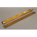 Two Victorian brass mounted boxwood slide rules, one marked Dring & Fage Makers, 56 Stamford St,