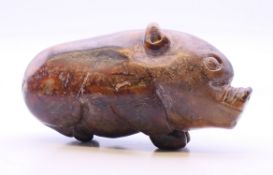 An archaic style jade/hardstone pig. 7.5 cm long.