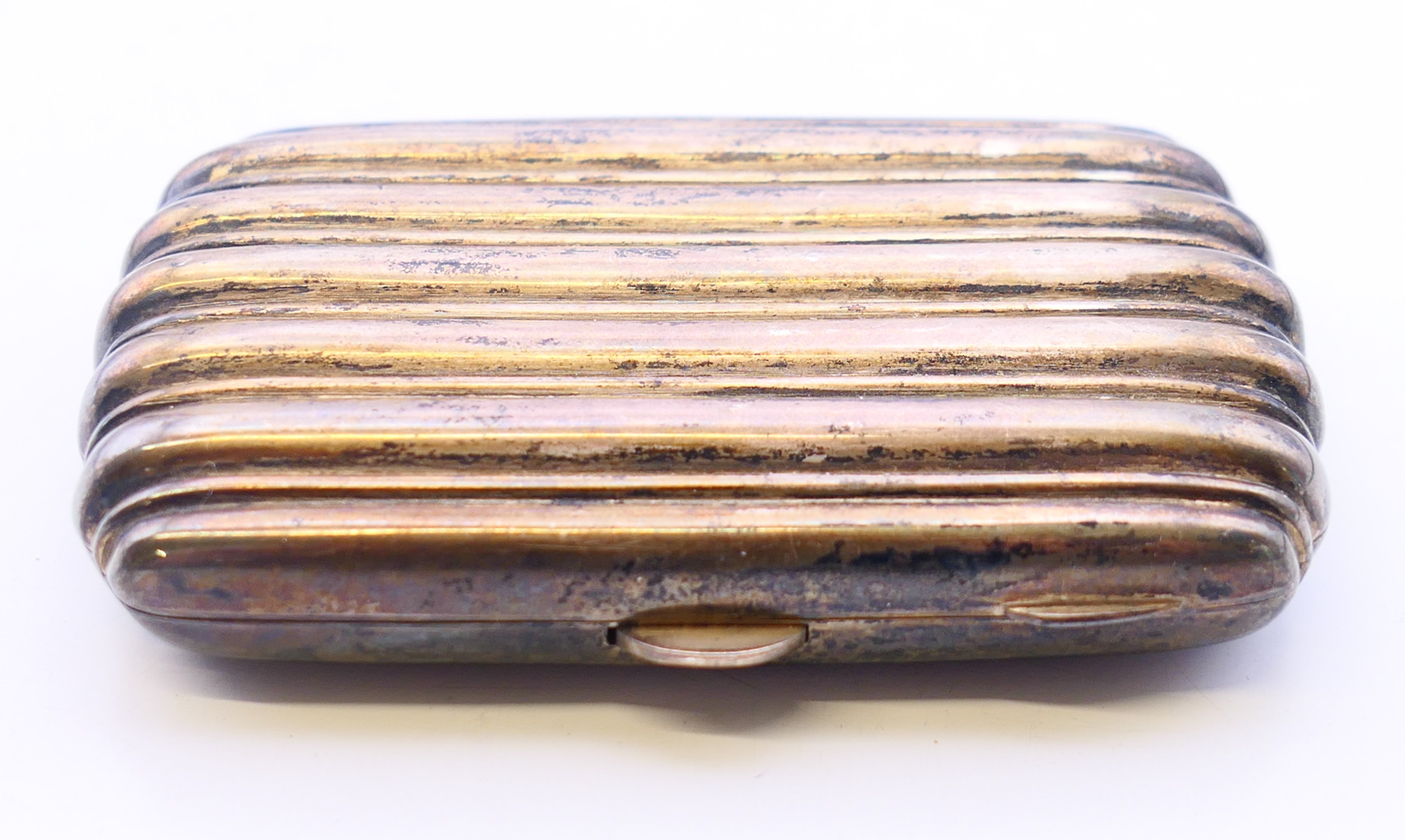 A silver cigarette case. 8 cm x 5 cm. 49.9 grammes total weight. - Image 2 of 4