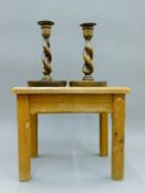 A pair of oak barley twist candlesticks and an oak stool. The stool 32.5 cm long.