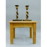 A pair of oak barley twist candlesticks and an oak stool. The stool 32.5 cm long.