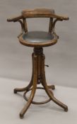 An early 20th century bentwood revolving bar chair. 54 cm wide.