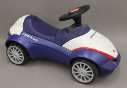 A BMW child's ride on car. 65 cm long.