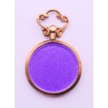 A 9 ct gold double photo locket pendant. 3.5 cm high including suspension loop.