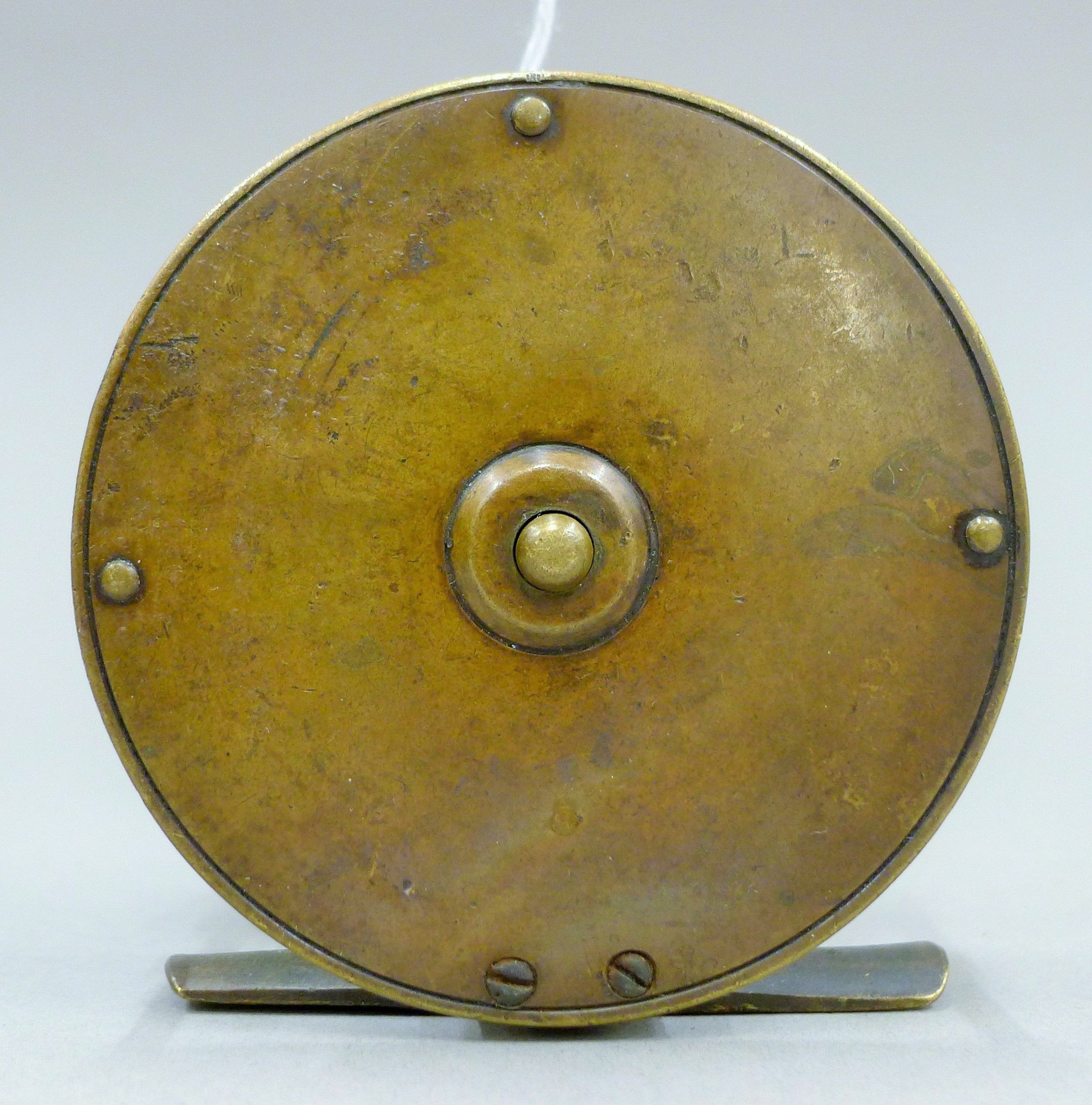 An Allcocks Brass platewind fly reel with early Allcock Stag logo on the foot. 8 cm diameter. - Image 2 of 3