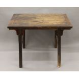 A 19th century Chinese side table. 100 cm long.