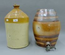 A Victorian stoneware spirit barrel and a George Mainprice of Soham flagon. The latter 40 cm high.