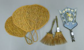 A quantity of various fans/face screens and two tribal combs. The largest 31 cm long.