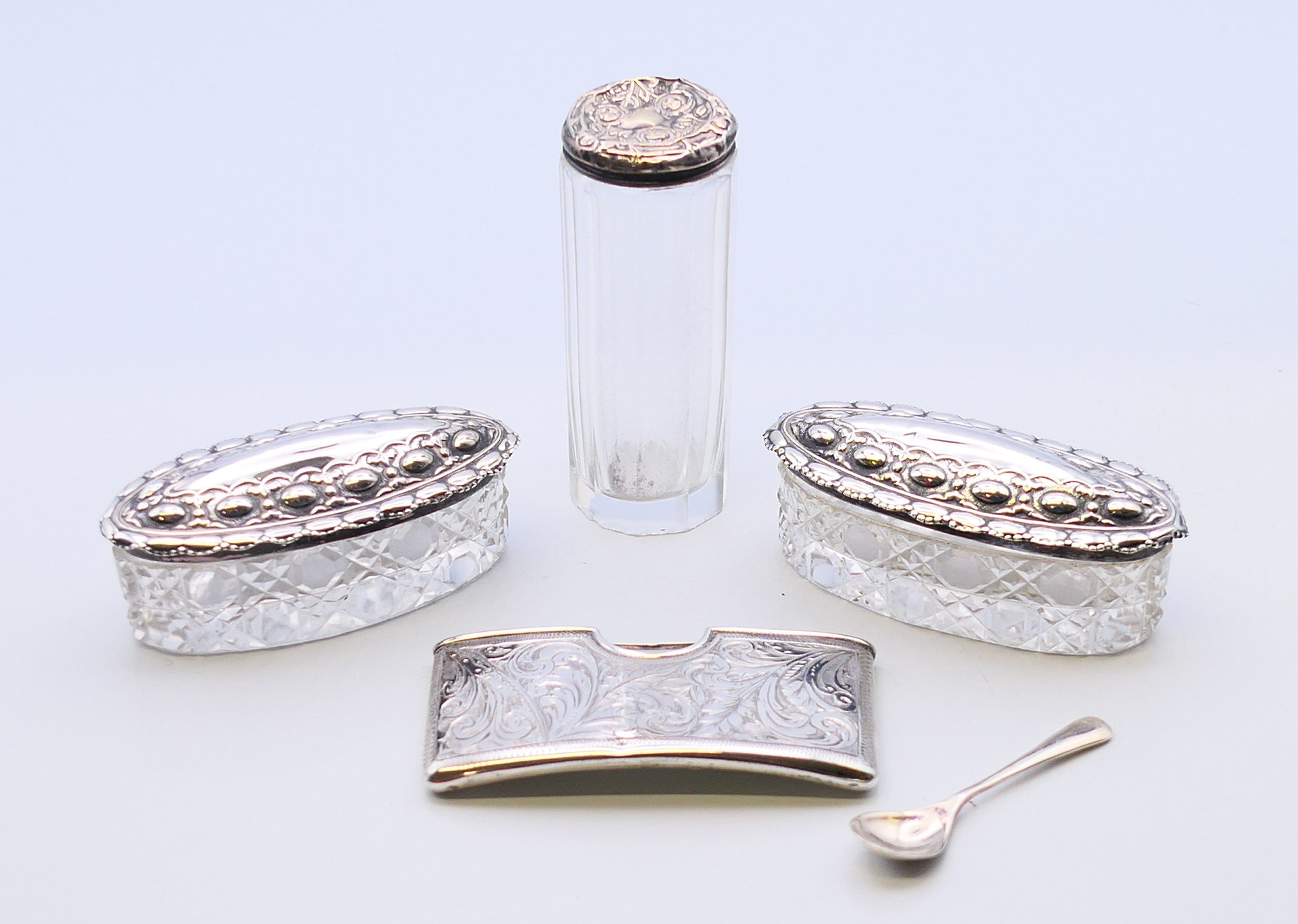 A pair of silver-lidded glass pots, a silver-lidded glass jar,