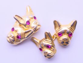 A pair of silver gilt dog head form cufflinks with Russian marks. 1.5 cm high.