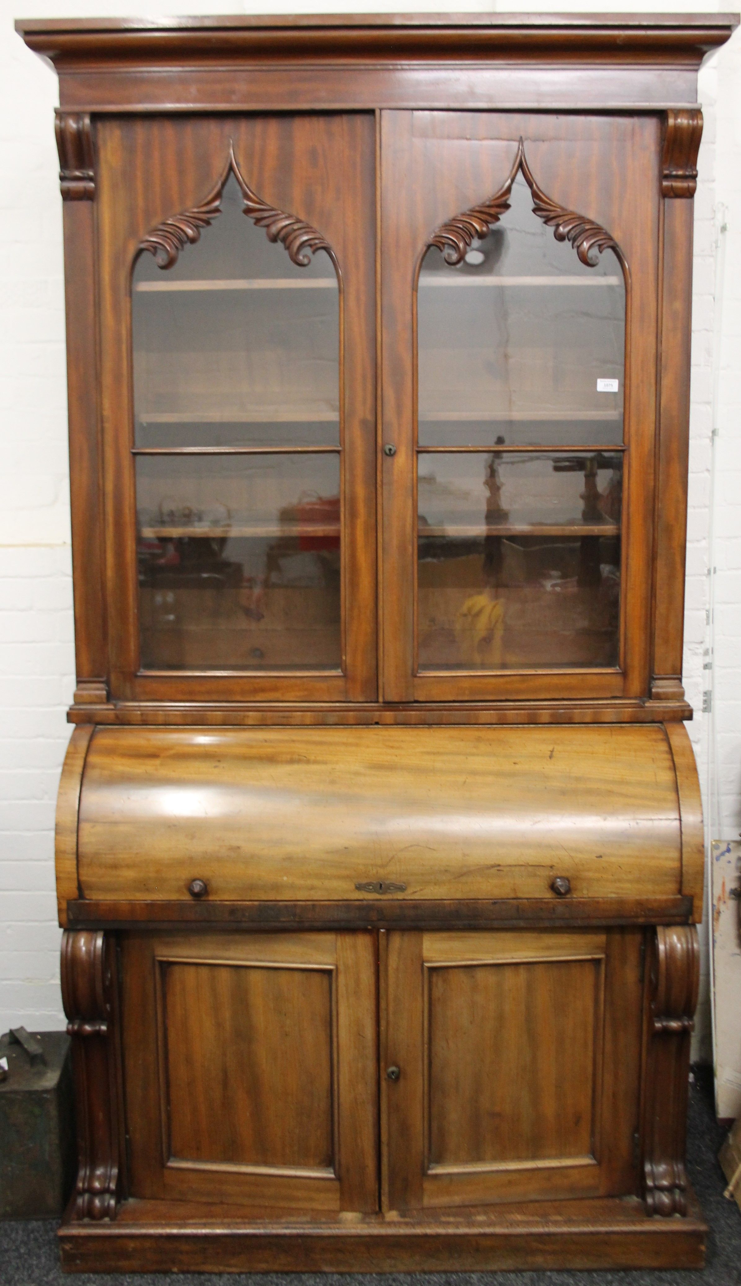 A Victorian mahogany cylinder bureau bookcase. 125 cm wide x 223 cm high.