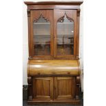 A Victorian mahogany cylinder bureau bookcase. 125 cm wide x 223 cm high.