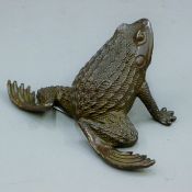 A bronze frog. 10 cm long.