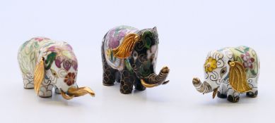 Three cloisonne elephants. Largest 4 cm high.