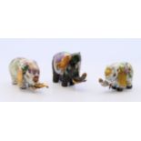 Three cloisonne elephants. Largest 4 cm high.