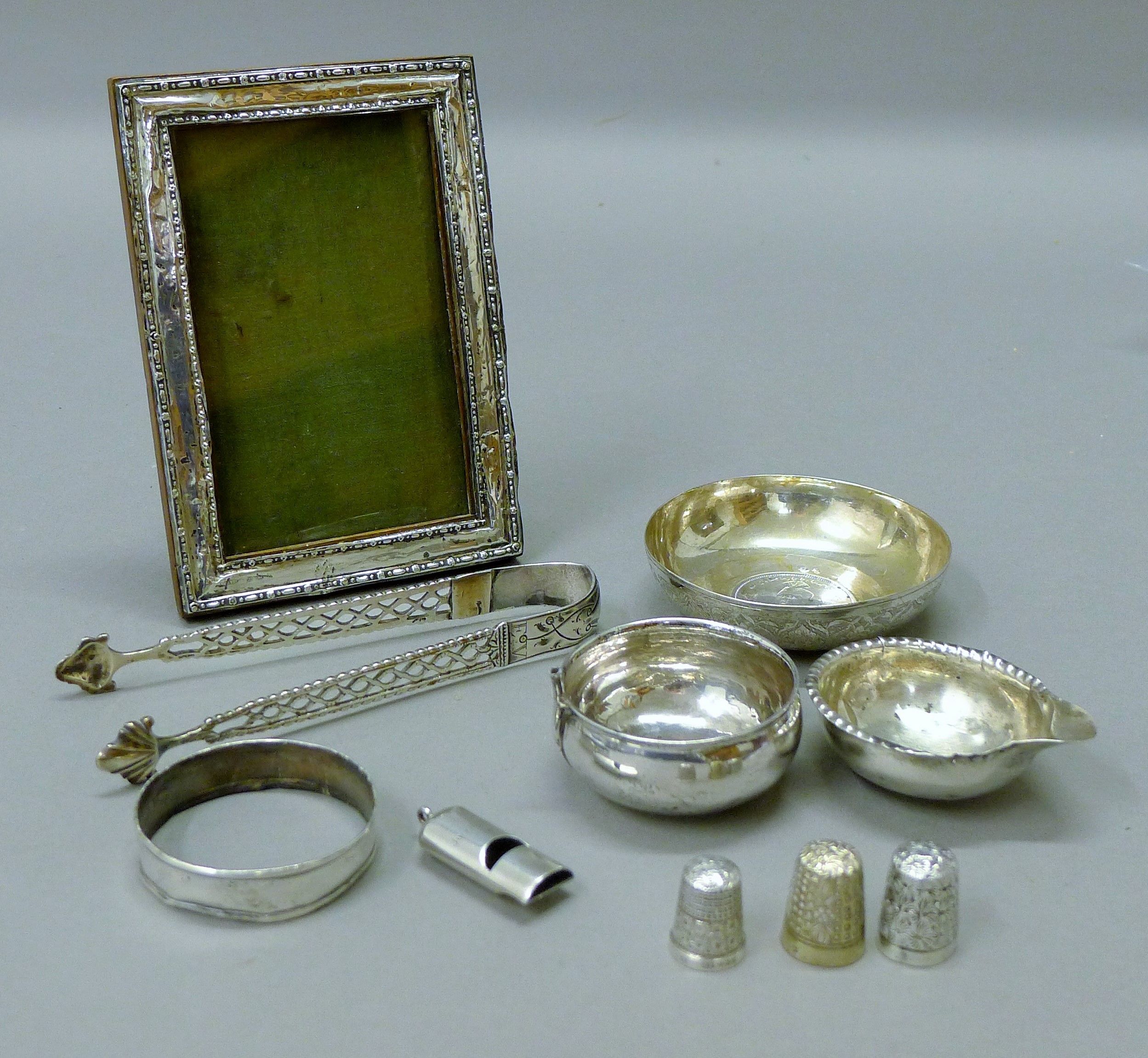 A quantity of silver items, including a Sampson & Mordan 1901 silver whistle,