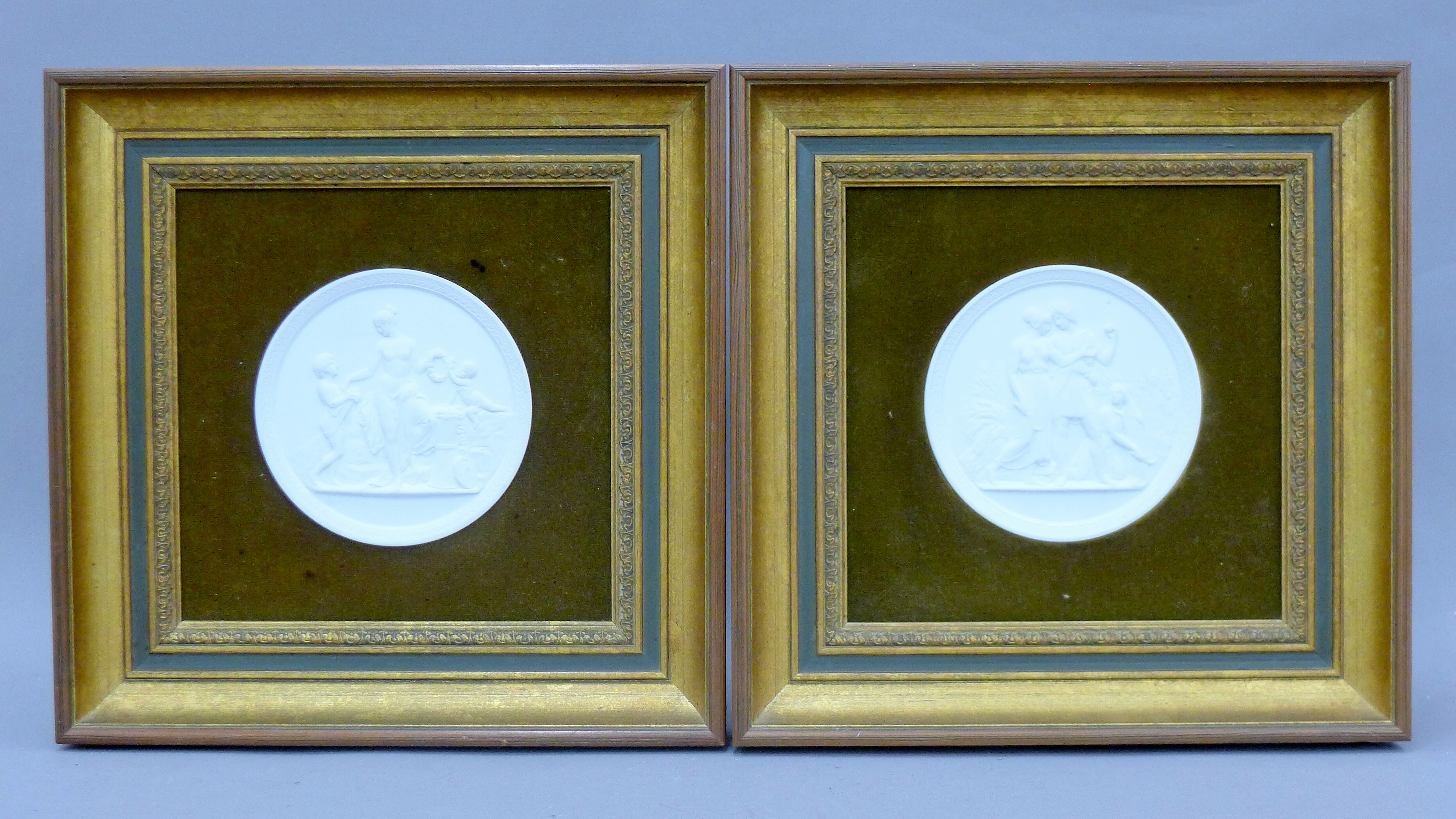 A pair of Copenhagen porcelain plaques, each depicting a classical scene, each framed. 32.