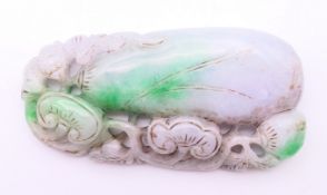 A large jade two-tone pendant. 9 cm x 4.75 cm.