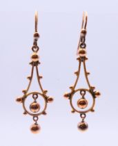 A pair of Victorian rose gold (tests at 9 ct gold) ball drop earrings 1.8 grammes. 3 cm high.