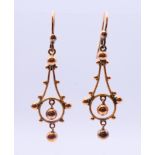 A pair of Victorian rose gold (tests at 9 ct gold) ball drop earrings 1.8 grammes. 3 cm high.