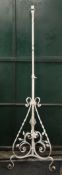 A Victorian wrought iron standard lamp. 177 cm high.