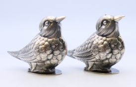 A pair of silver vintage novelty salt and peppers in the form of birds, hallmarked,