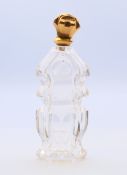 An 18 ct gold topped French scent bottle. 12 cm high.