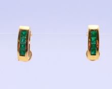 A pair of 18 ct gold emerald earrings. 1.5 cm high.