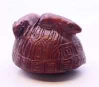 A netsuke in the form of two mice on a tortoiseshell shell. 3.5 cm high.