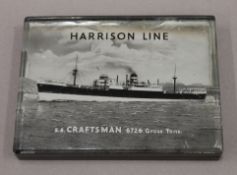 A glass paperweight advertising the Steamer S.S. Craftsman, Harrison Line. 10 x 7.5 cm.