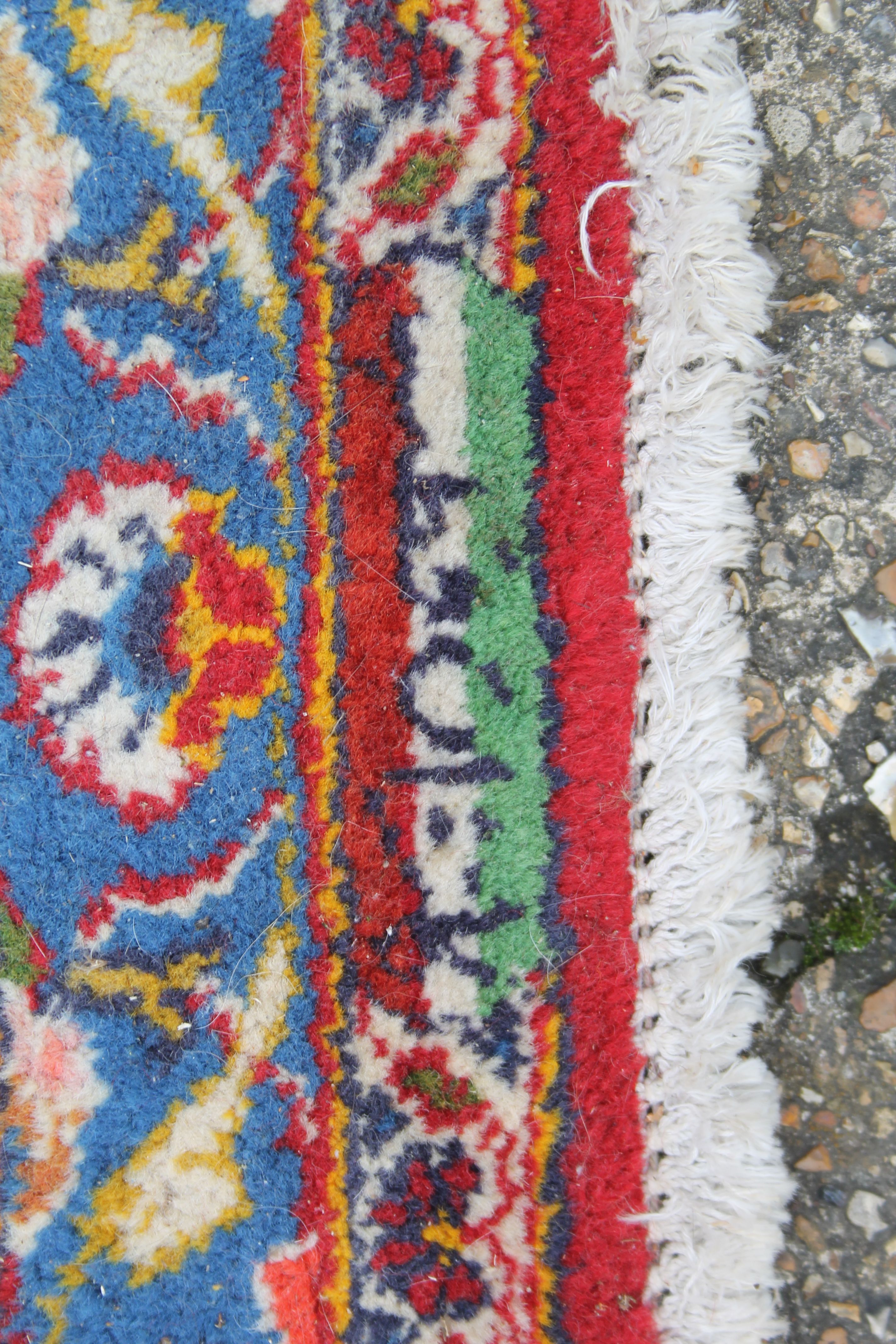 A large red ground rug. 294 x 400 cm. - Image 7 of 8