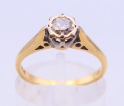 An 18 ct gold diamond solitaire ring. Ring size J/K.