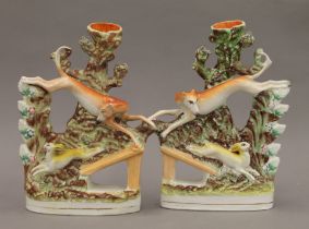 A pair of 19th century Staffordshire coursing models (left & right) each modelled as a greyhound