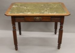 A Victorian oak single drawer writing table. 106 cm wide.