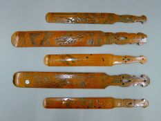 Five Japanese carved wooden page turners. The longest 40 cm long.